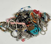 A large collection of bead necklaces, white metal bracelets, Pandora style charm bracelets, fresh