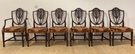 A set of six (5+1) early 20th century Hepplewhite style mahogany dining chairs, the shield back with