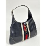 A vintage Gucci blue leather crescent shaped shoulder bag with adjustable strap and a lobster claw