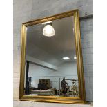 A large contemporary gilt framed wall mirror, (124cm x 104cm)