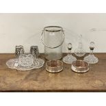 A pair of cut glass silver mounted decanters (h 16cm) together with a pair of silver mounted wine