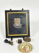 A framed white metal and yellow metal embroidered crest in ebonised glazed frame, (excluding frame