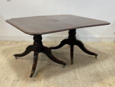 A George IV mahogany dining table, over twin pillars, each standing on four splayed supports with