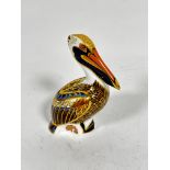 A Royal Crown Derby paperweight figure of a brown Pelican 1998, decorated with pink, blue, brown and