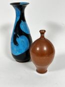 A hand thrown flared rim baluster vase with turquoise blue and dark blue glazed abstract design (h.
