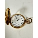 A gilt metal full hunter pocket watch with engraved initials AJM with enamelled dial and