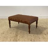 A good late 19th century walnut footstool, the top upholstered in striped red and gilt chenille