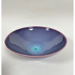 A modern Chinese bowl with lavender with underlying blue turquoise central glaze to inner surface,