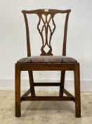 A George III country elm chair, splat back over drop in seat pad, raised on square moulded supports,