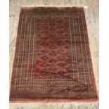 A hand knotted Turkoman Bokhara rug of typical design, 196cm x 131cm