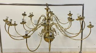 A large Dutch style brass chandelier, the central column issuing 18 scrolling branches D170cm