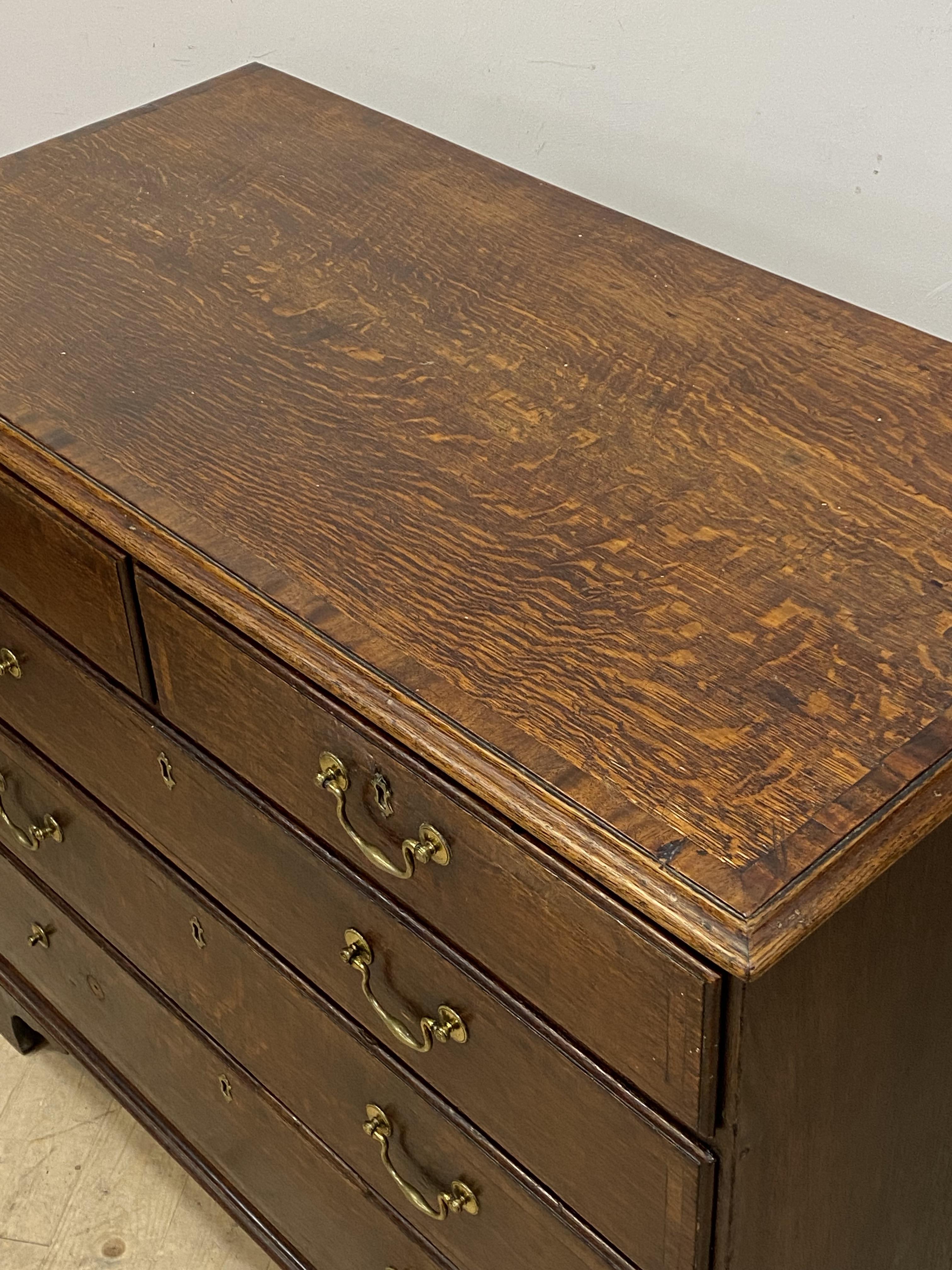A George III oak chest, mahogany cross banded top and two short and three long graduated drawers, - Image 3 of 4