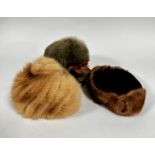 A sheepskin 1920s lady's had with ribbon, a mink trimmed hat and a pale mink 1950s hat
