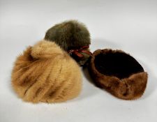 A sheepskin 1920s lady's had with ribbon, a mink trimmed hat and a pale mink 1950s hat