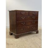 A George III oak chest, mahogany cross banded top and two short and three long graduated drawers,
