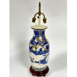 A Japanese baluster vase converted to lamp depicting scenes with cranes and prunis trees, blue