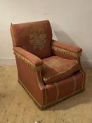 An early 20th century upholstered armchair (A/F) h90cm, w75cm