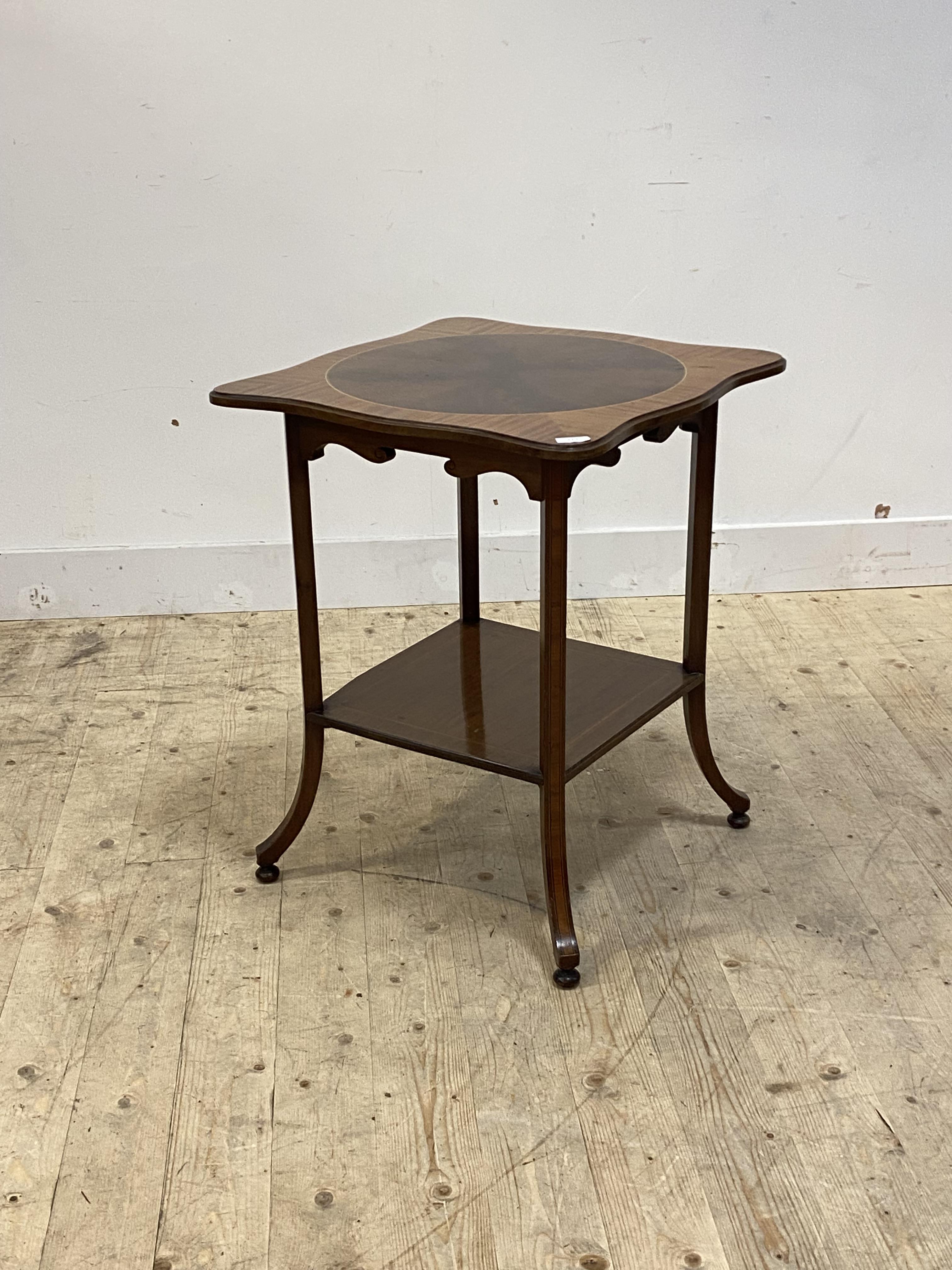 A good Edwardian satinwood and mahogany occasional table, the undulating square top with quarter