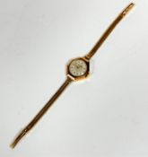 A lady's Helvetica super shock resistant 9ct gold wrist watch on 9ct gold flexible link bracelet,