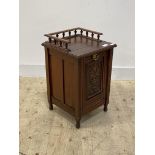 An Edwardian carved walnut coal purdonium, with three quarter galleried top, turned supports, H63cm,