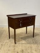 An Edwardian inlaid mahogany side table, fitted with two drawers, over square tapered supports