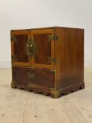 A Chinese style birds eye veneered and brass bound cabinet chest, the twin doors opening to three