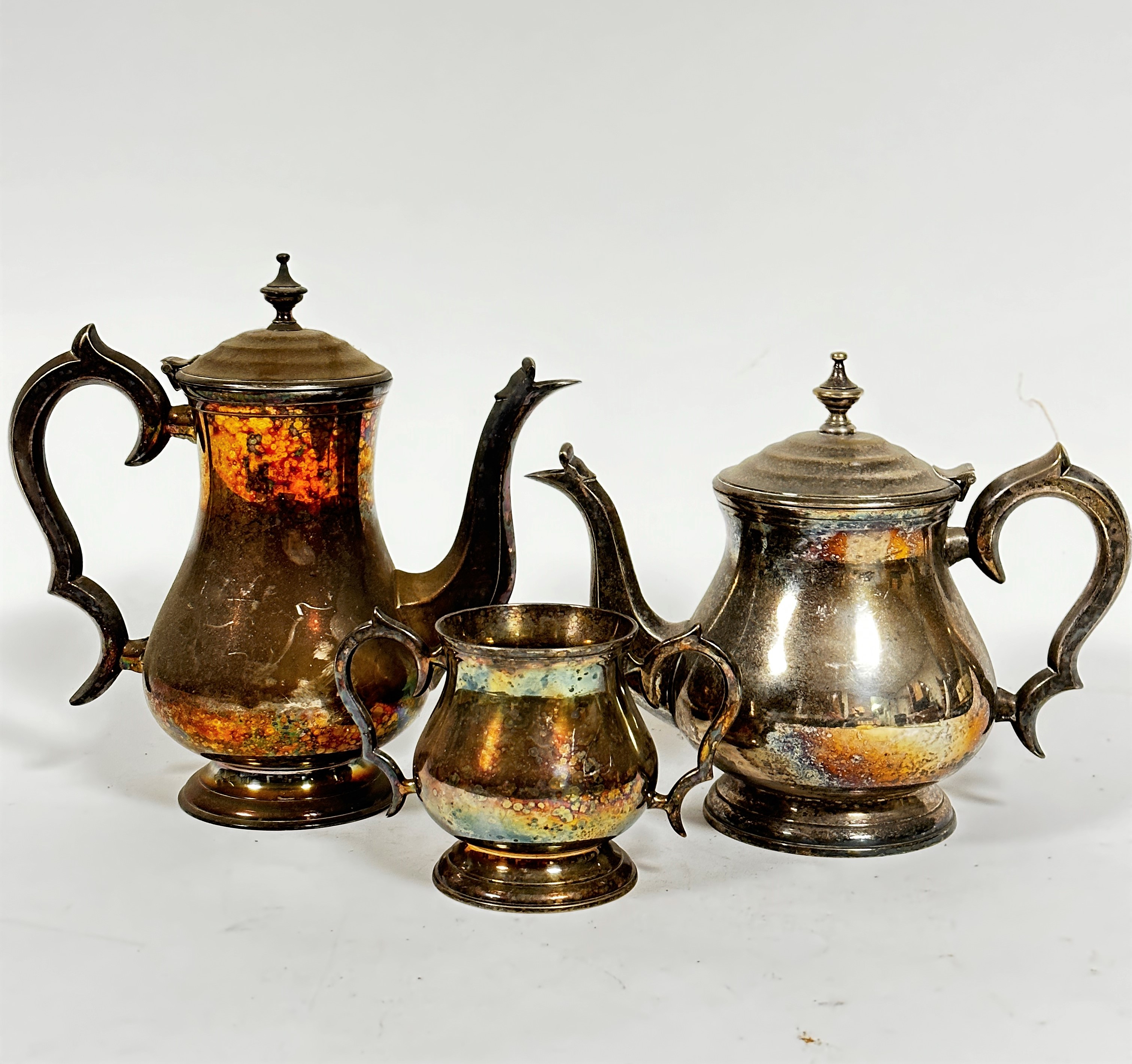 An Epns baluster three piece part teaset including hot water pot (24cm), tea pot and two handled