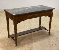 An Edwardian walnut wash stand, the grey marble top over frieze drawer, raised on turned supports