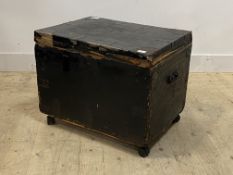 An early 20th century canvas covered and metal bound trunk, moving on later castors, h52cm, w66cm,