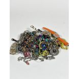 A large collection of bead necklaces, white metal pendants, bracelets, various watches etc