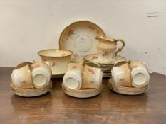 An Edwardian china tea service, comprising twelve cups and saucers, twelve side plates, two