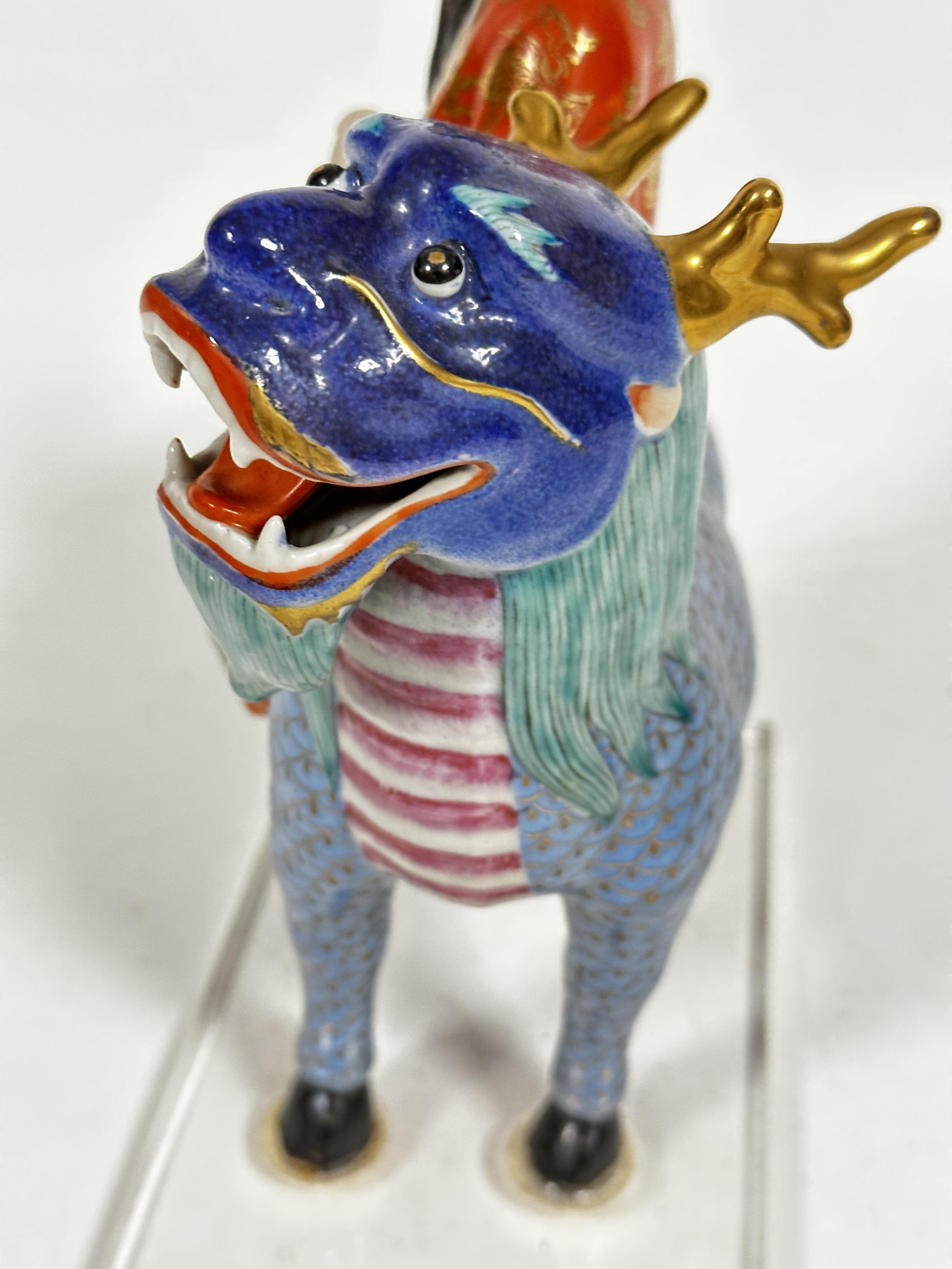 A Japanese porcelain figure of a dignitary with fan, seated on a deer, mounted on plastic base, (7cm - Image 5 of 6