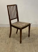 An Edwardian inlaid mahogany spar back chair with upholstered seat raised on square tapered