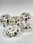 A Victorian china 19thc part dinner service in the Chinese taste, with scalloped borders,