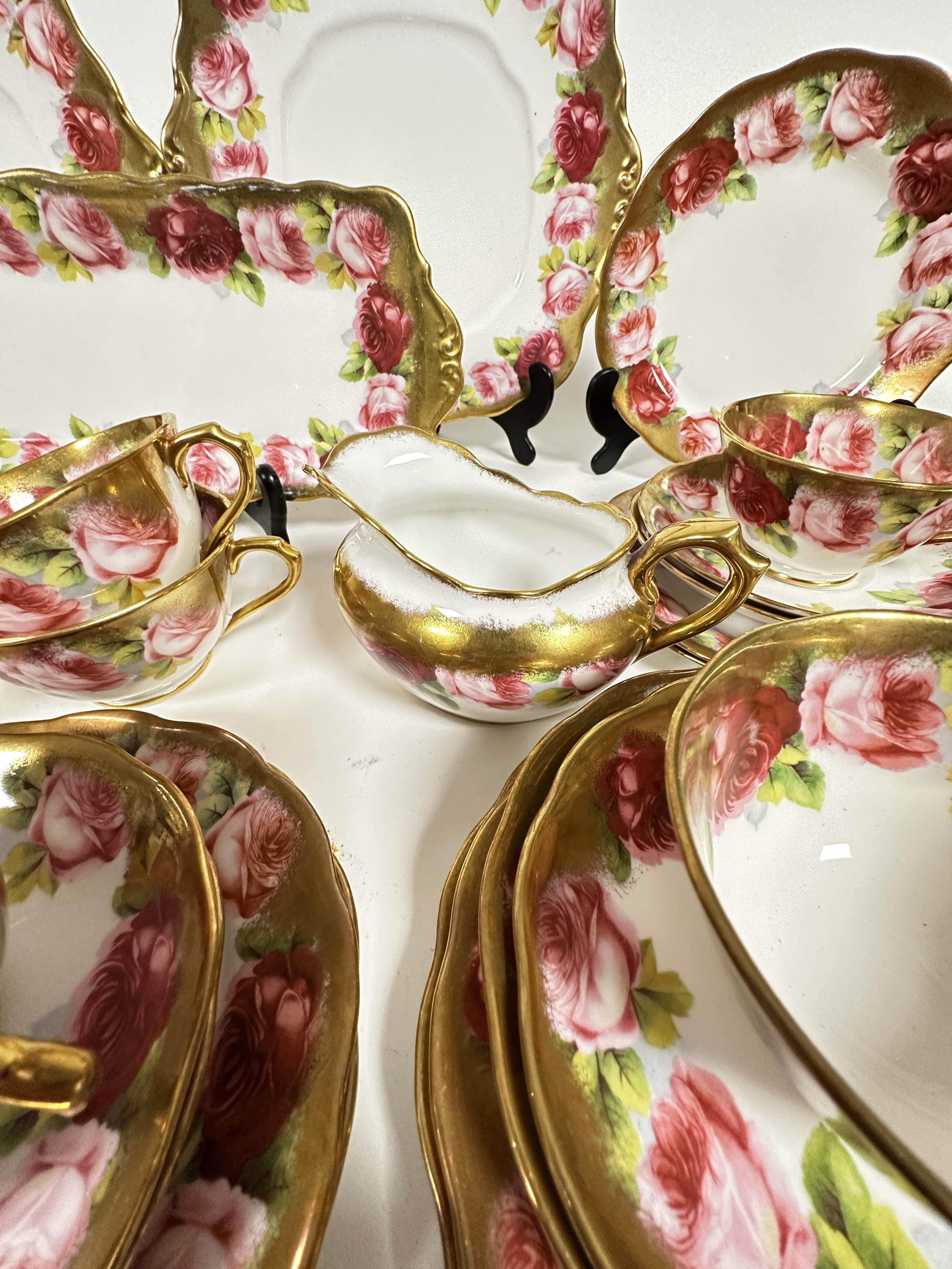 A Royal Albert pink rose and gilt bordered teaset of thirty nine pieces, including two cake - Image 6 of 9