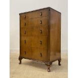 A mid 20th century mahogany chest, fitted with five graduated drawers, raised on cabriole