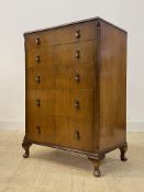 A mid 20th century mahogany chest, fitted with five graduated drawers, raised on cabriole