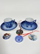 A pair of Royal Copenhagen Lucia Fest, The Festival of St Lucia, coffee cans and saucers, and