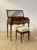 A late 20th century French cherry wood dressing table, the reeded top lifting to a mirror and