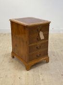 A yew wood two drawer filing cabinet, with tooled red leather writing surface to top, H78cm,