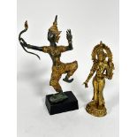 A gilt bronze dancing Balinese figure with bow, raised on treen base, one finger missing, (h 33cm