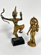 A gilt bronze dancing Balinese figure with bow, raised on treen base, one finger missing, (h 33cm