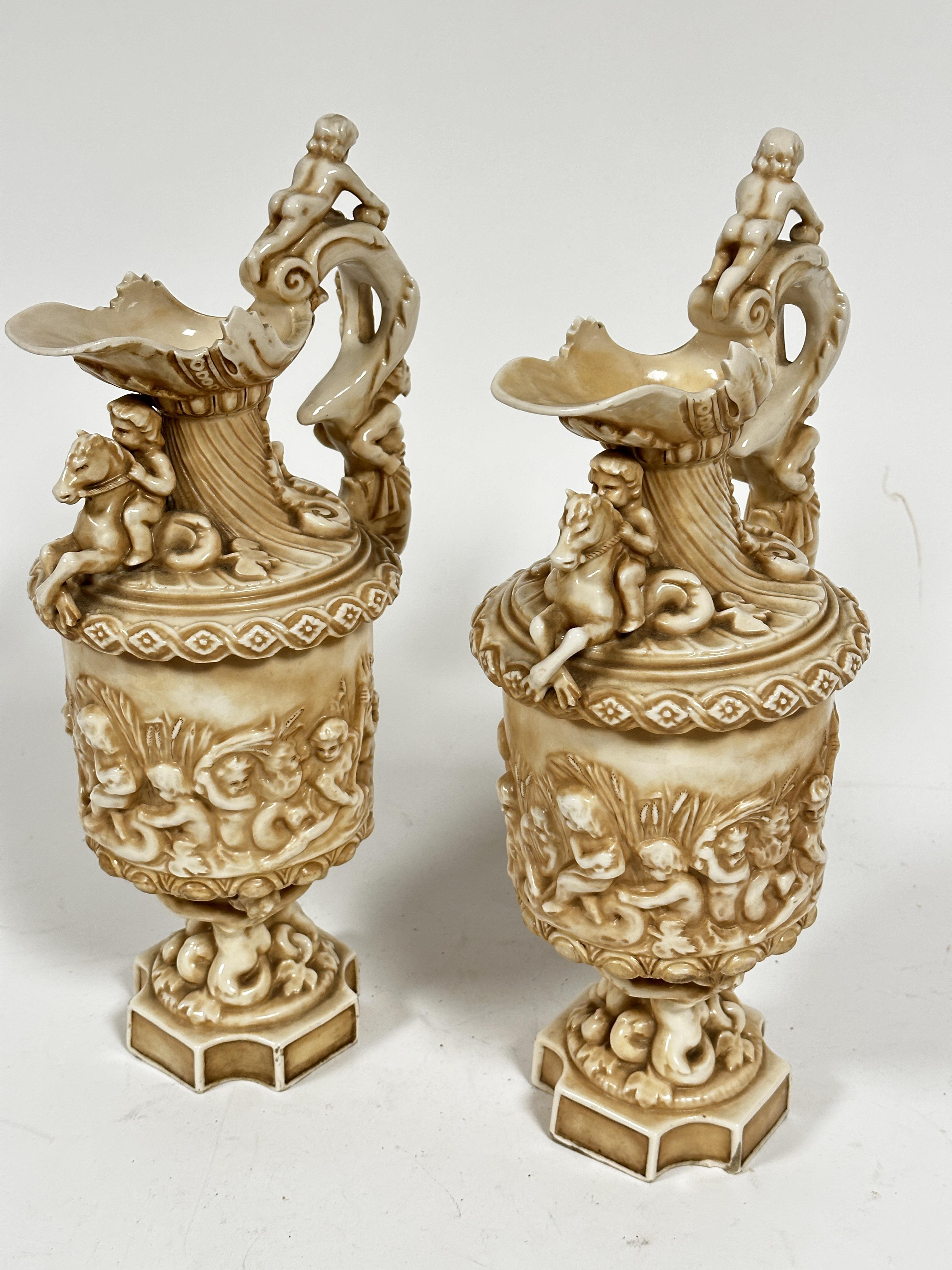 A pair of late 19thc Rudolstadt Straus & Sohne ewers, the handles mounted with cherubs with mask - Image 4 of 12
