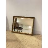 An early 20th century gilt composition framed wall mirror with bevelled plate 72cm x 94cm