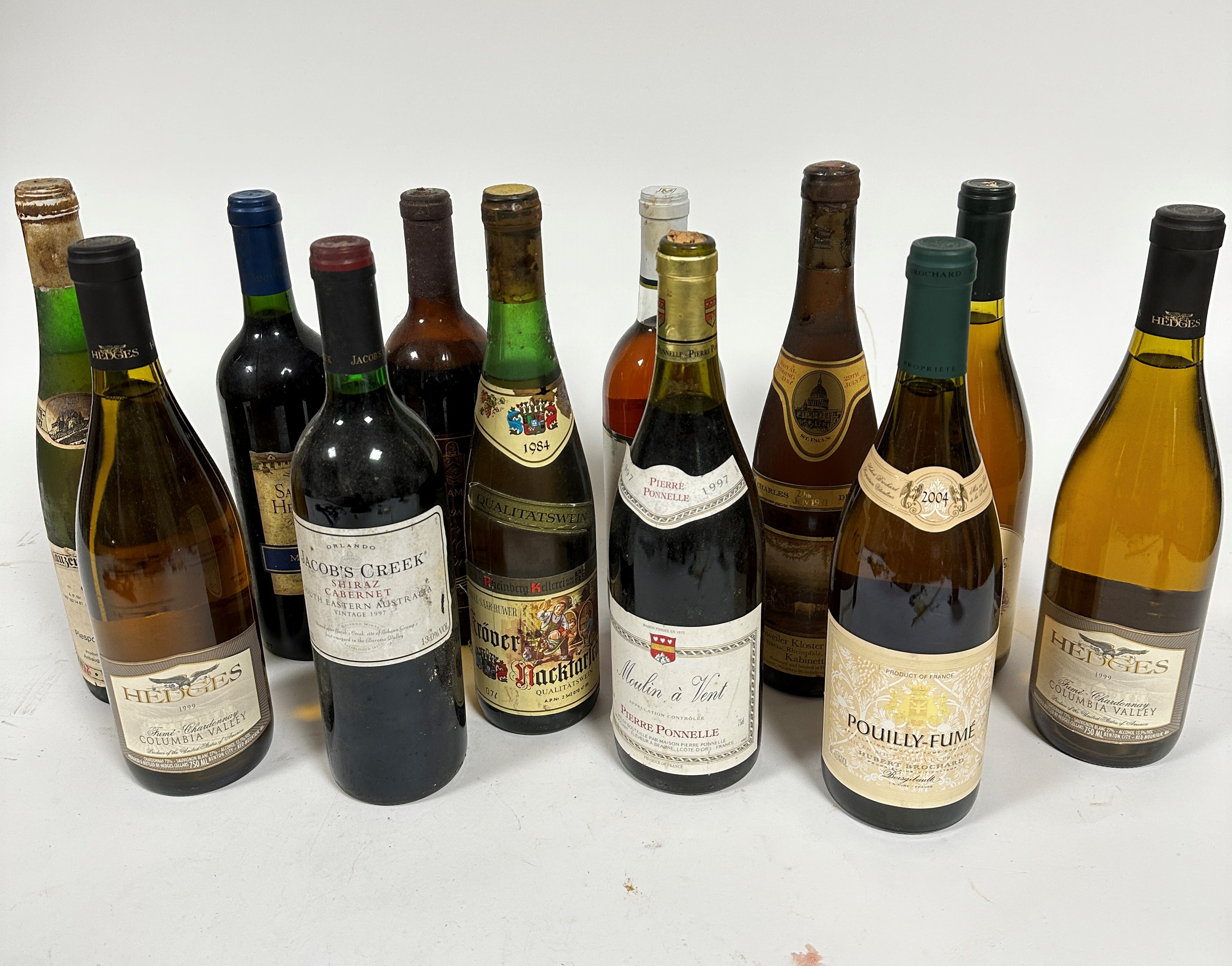 A group of four bottles of red and eight bottles of white wine, including Pouilly-Fume 2004,