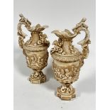 A pair of late 19thc Rudolstadt Straus & Sohne ewers, the handles mounted with cherubs with mask