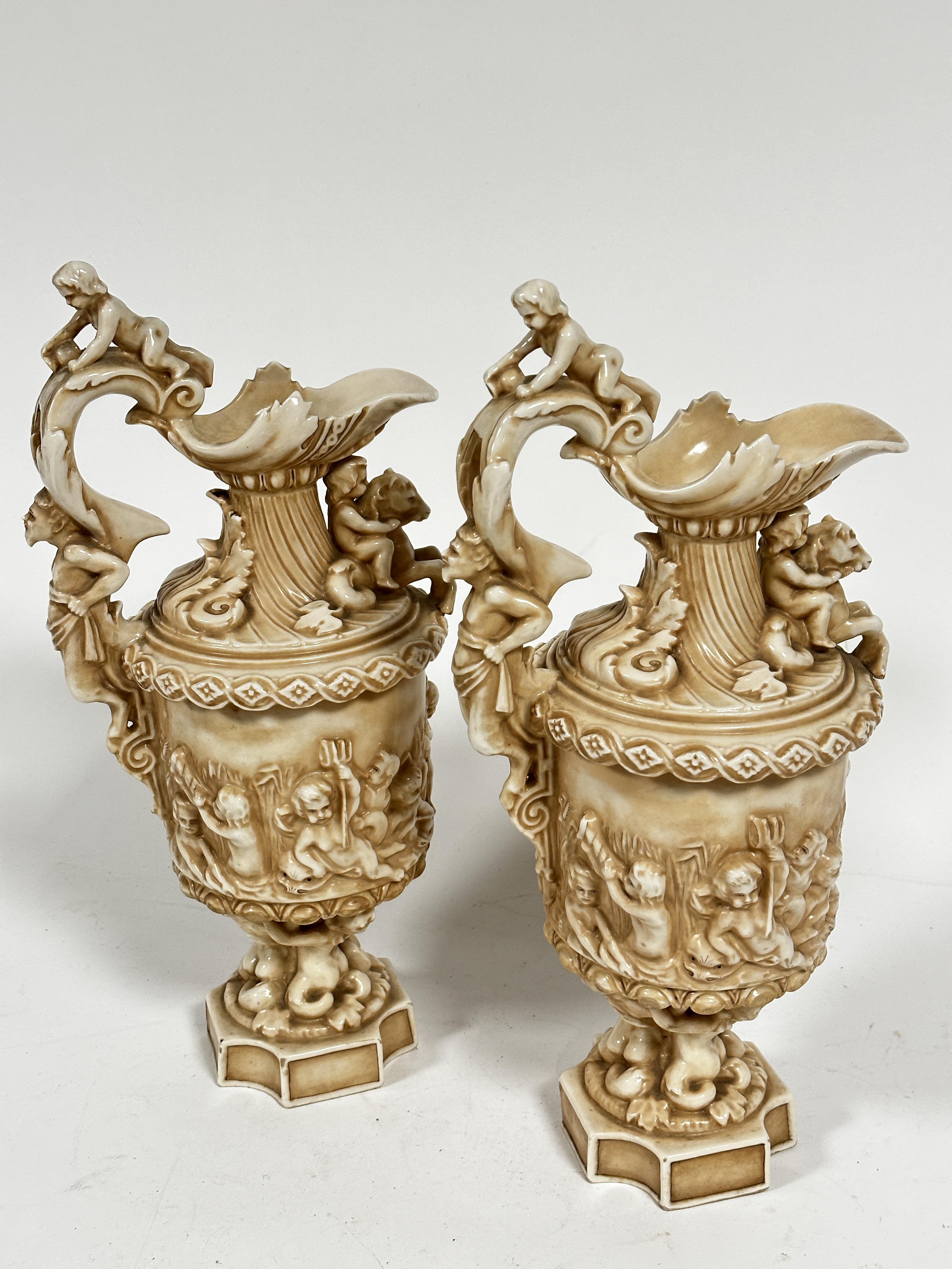 A pair of late 19thc Rudolstadt Straus & Sohne ewers, the handles mounted with cherubs with mask - Image 6 of 12
