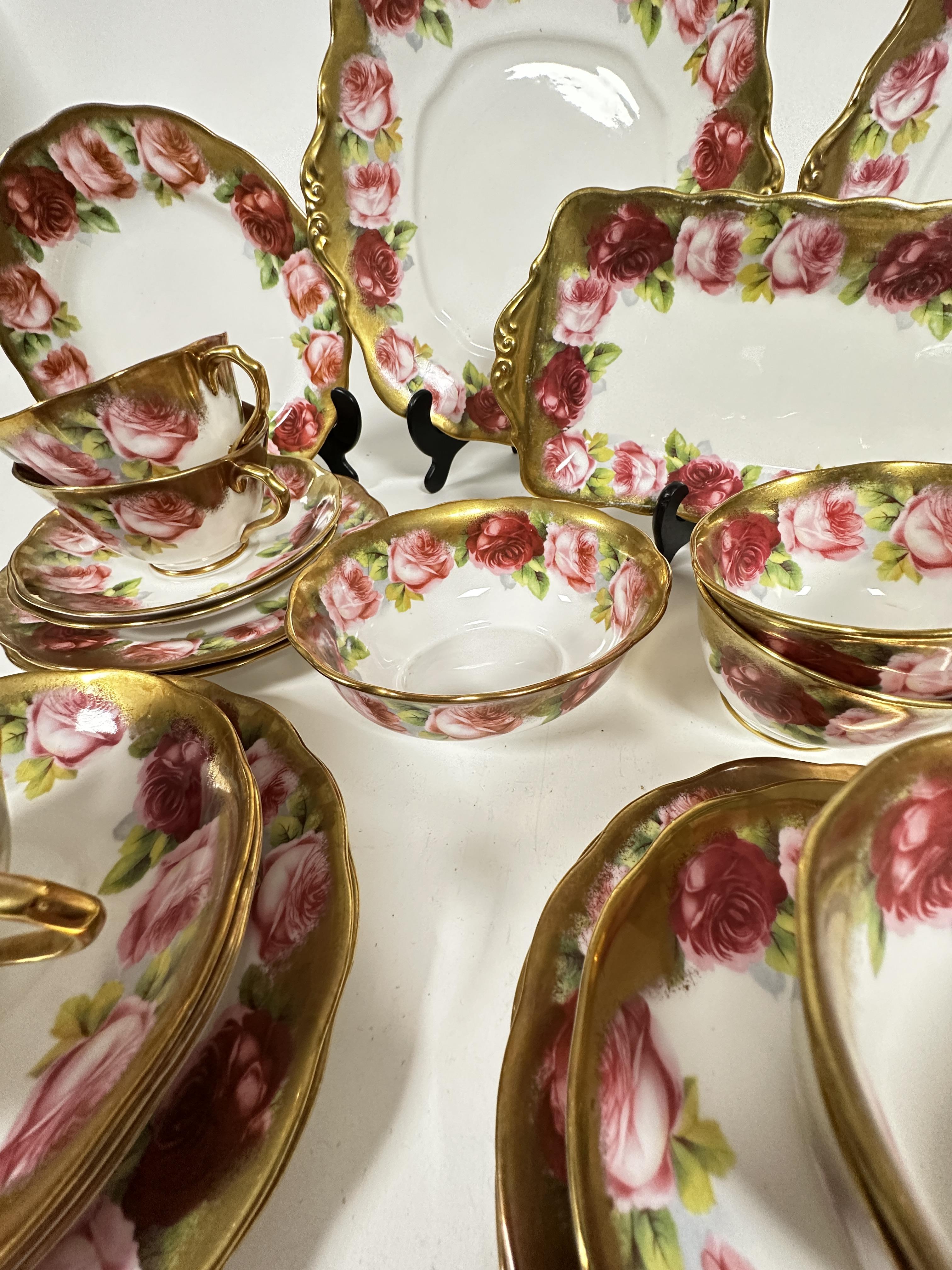 A Royal Albert pink rose and gilt bordered teaset of thirty nine pieces, including two cake - Image 7 of 9