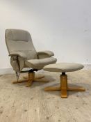 A Stressless style electric reclining lounge chair with footstool, upholstered in cream faux