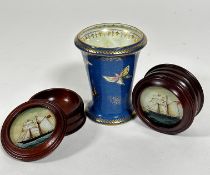 A pair of mahogany circular lidded boxes with eglomise style panels with two masted sailing boats (